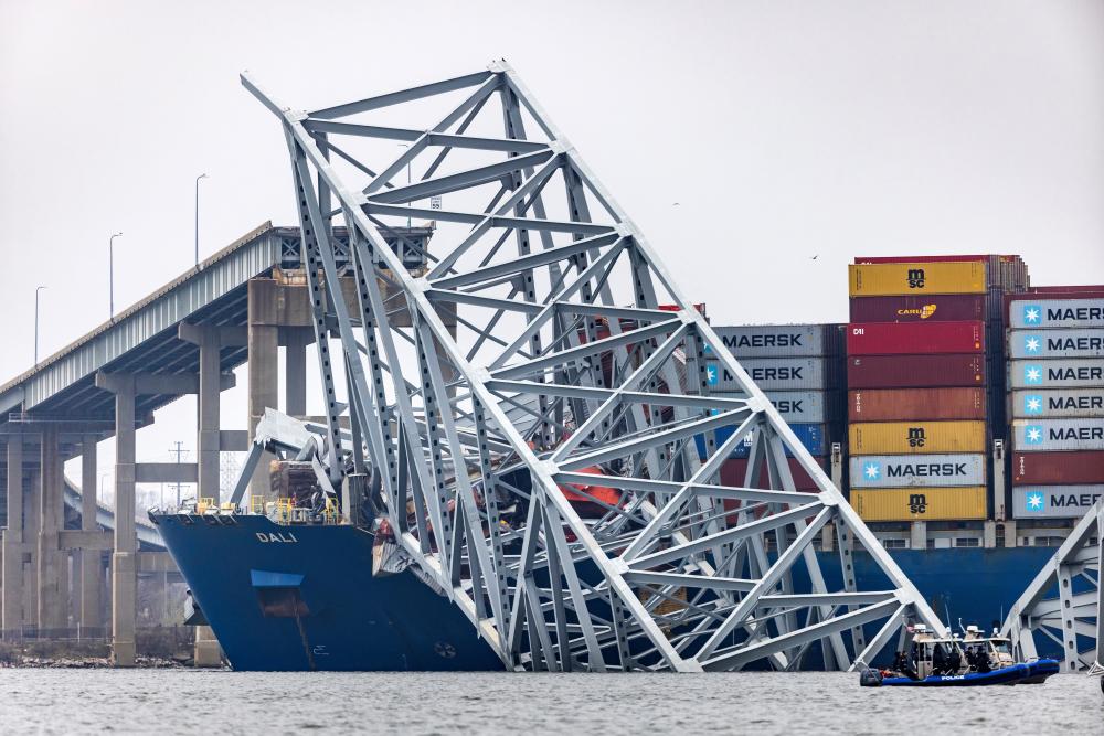 Baltimore bridge collapse: six declared dead as investigators recover black box