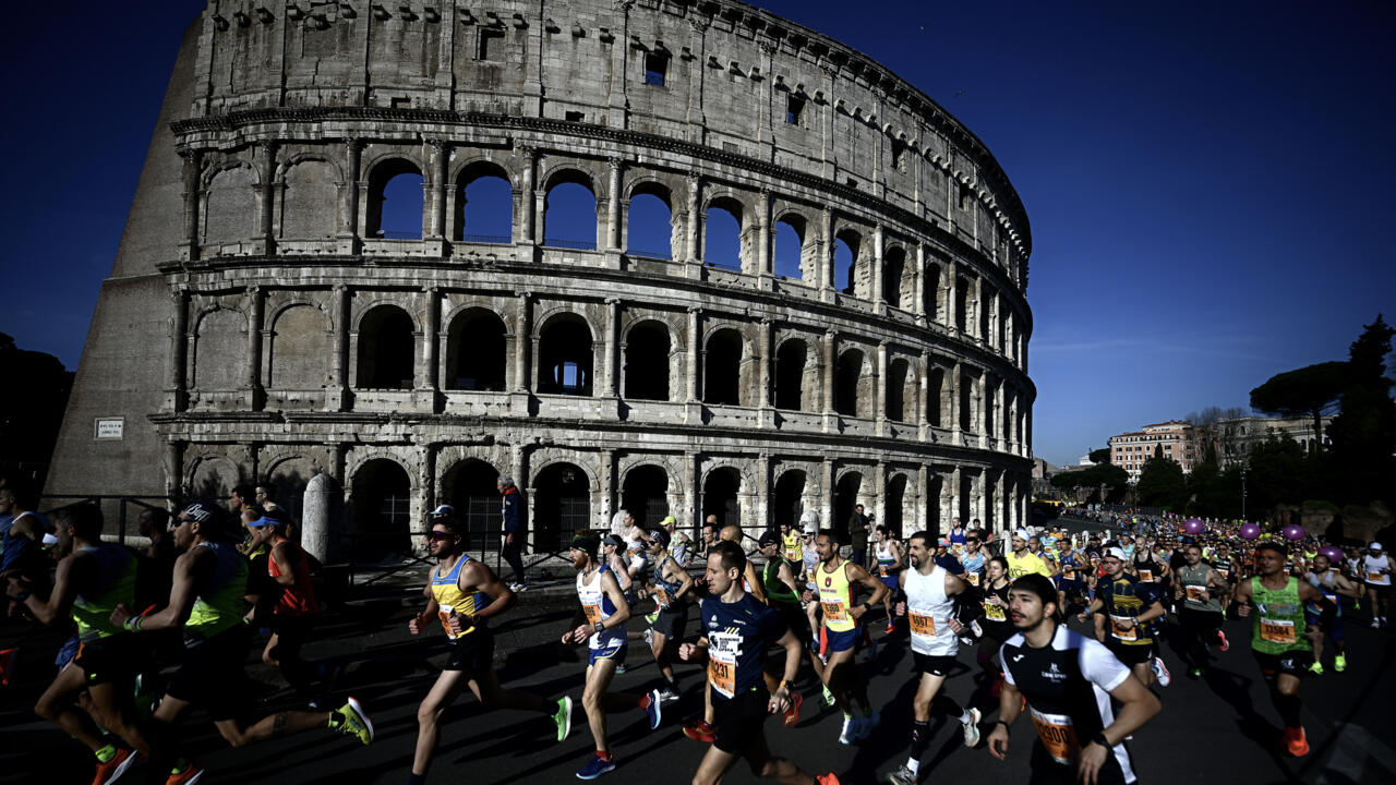 Climate activists disrupt Rome marathon to ‘sound alarm’ on looming disasters