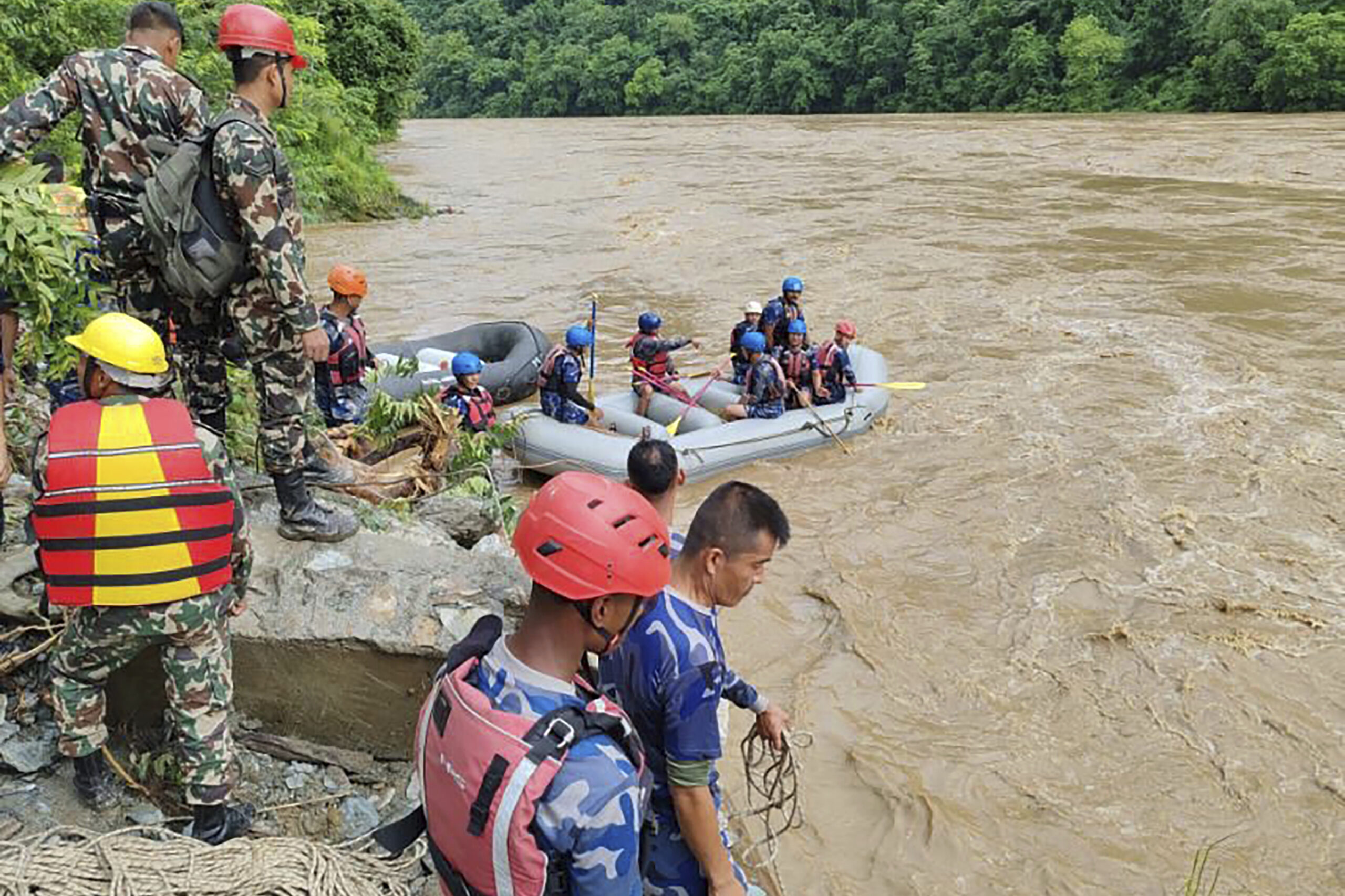 2 buses carrying at least 60 people swept into a river by a landslide in Nepal. 3 survivors found