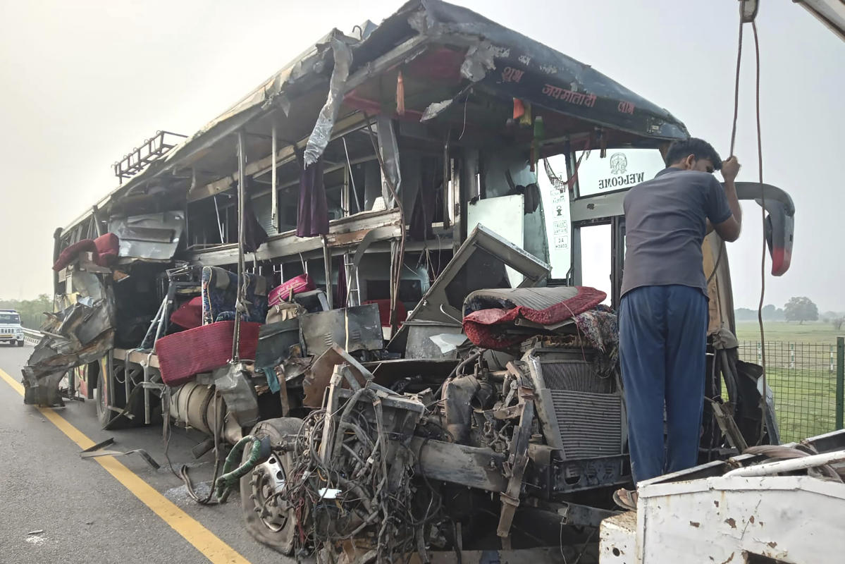 A double-decker bus collides with a milk truck in northern India, killing at least 18 people