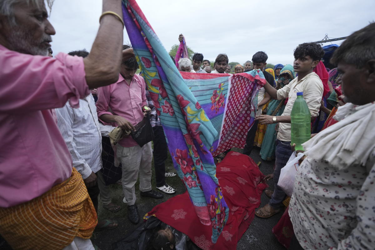 AP PHOTOS: Families of stampede victims in India ponder future without loved ones