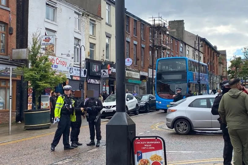 Armed police flood town centre as thugs with weapons spark chaos