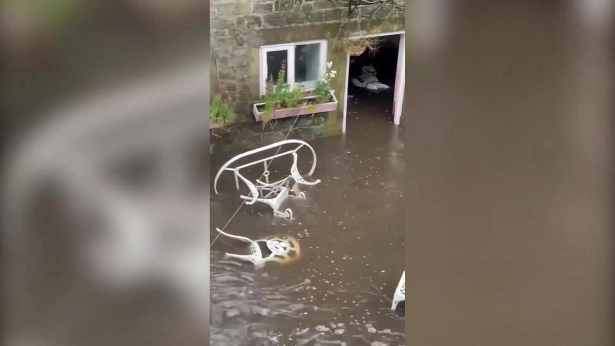 Flash flood fills up courtyard with water reaching two-feet high in seven minutes