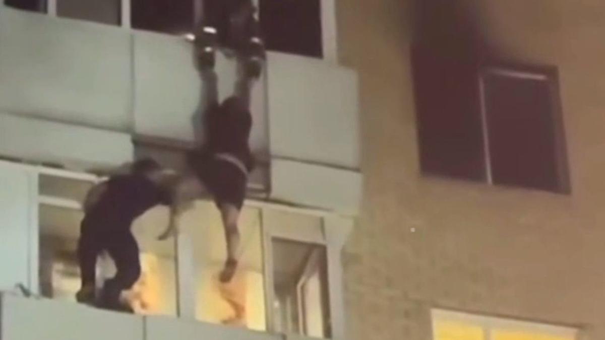 Heroic rescue: Neighbor catches woman falling from burning building