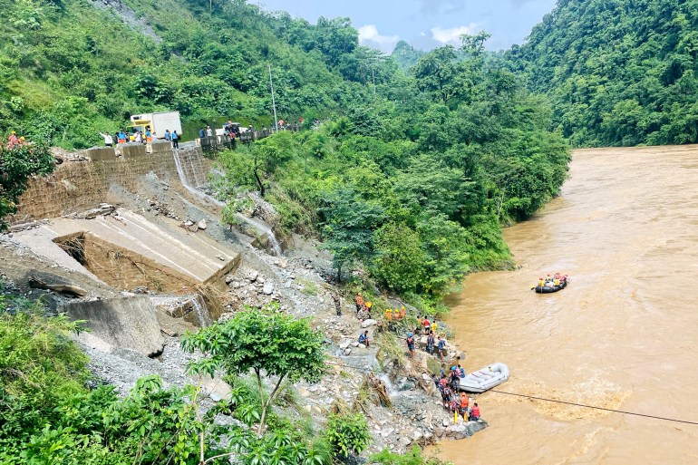 More than 60 people missing after two buses swept into river in Nepal