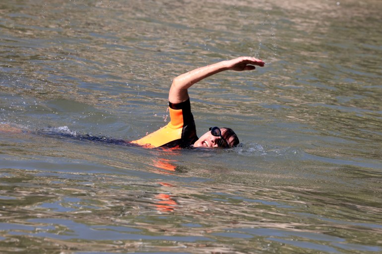 Paris mayor takes pre-Olympics dip to prove Seine clean ahead of 2024 Games