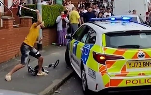 Police car flipped over and bus on fire in Leeds as riots break out