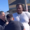 Shocking moment LAPD cop punches a man in the face while his hands are cuffed