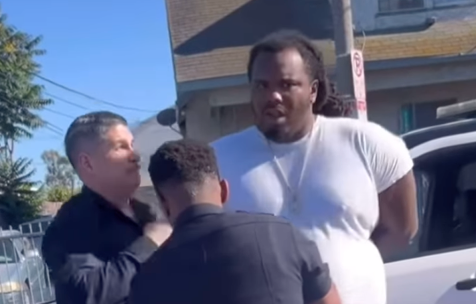 Shocking moment LAPD cop punches a man in the face while his hands are cuffed