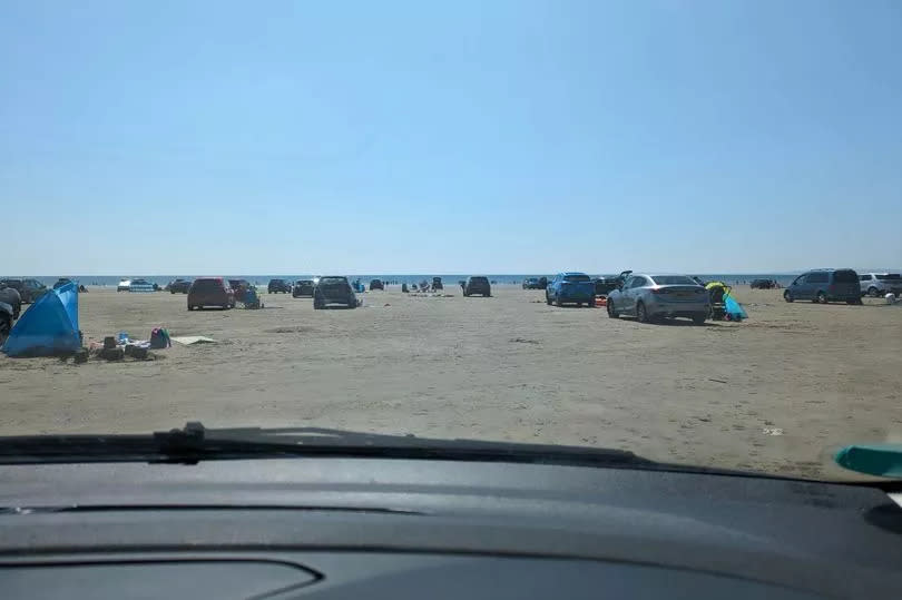 The beach in Wales where cars weave between families and do donuts and people warn ‘it’s only a matter of time’