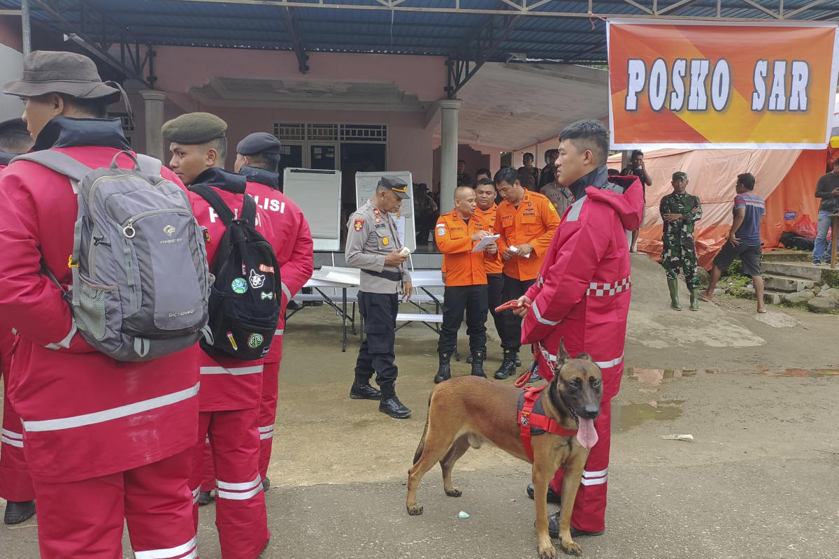 The search intensifies for dozens buried in an Indonesian landslide that killed at least 23 people