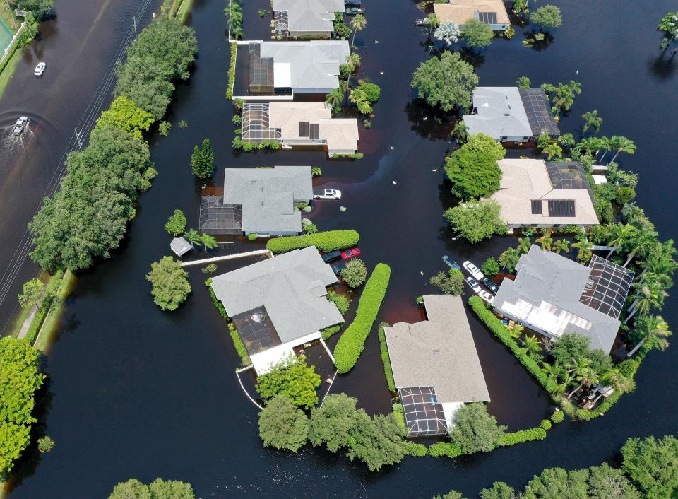 As flood waters swallow neighborhoods, frustrated Sarasota residents blame development