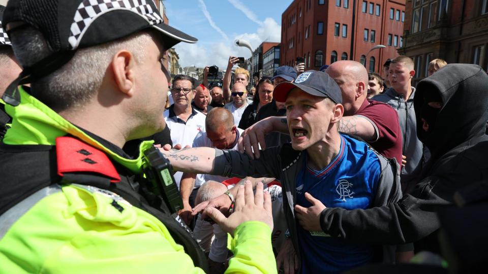 Chairs and bottles thrown as protesters clash in resort