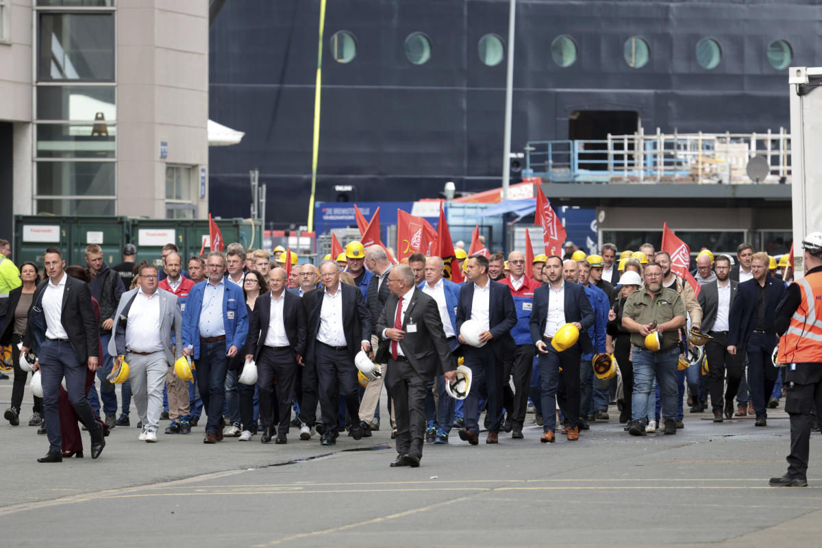 Germany’s Scholz pledges that his government will help rescue a troubled cruise ship maker