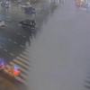 Water erupts from manhole during heavy rain in Tokyo