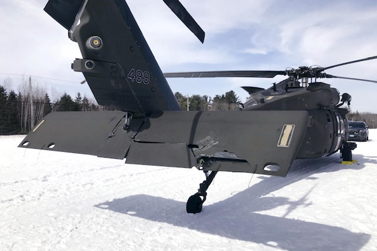 A snowmobiler who crashed into a parked Black Hawk helicopter is awarded  million