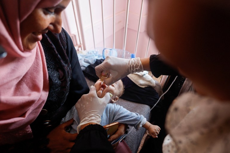 First children in Gaza given polio vaccines a day before planned UN rollout