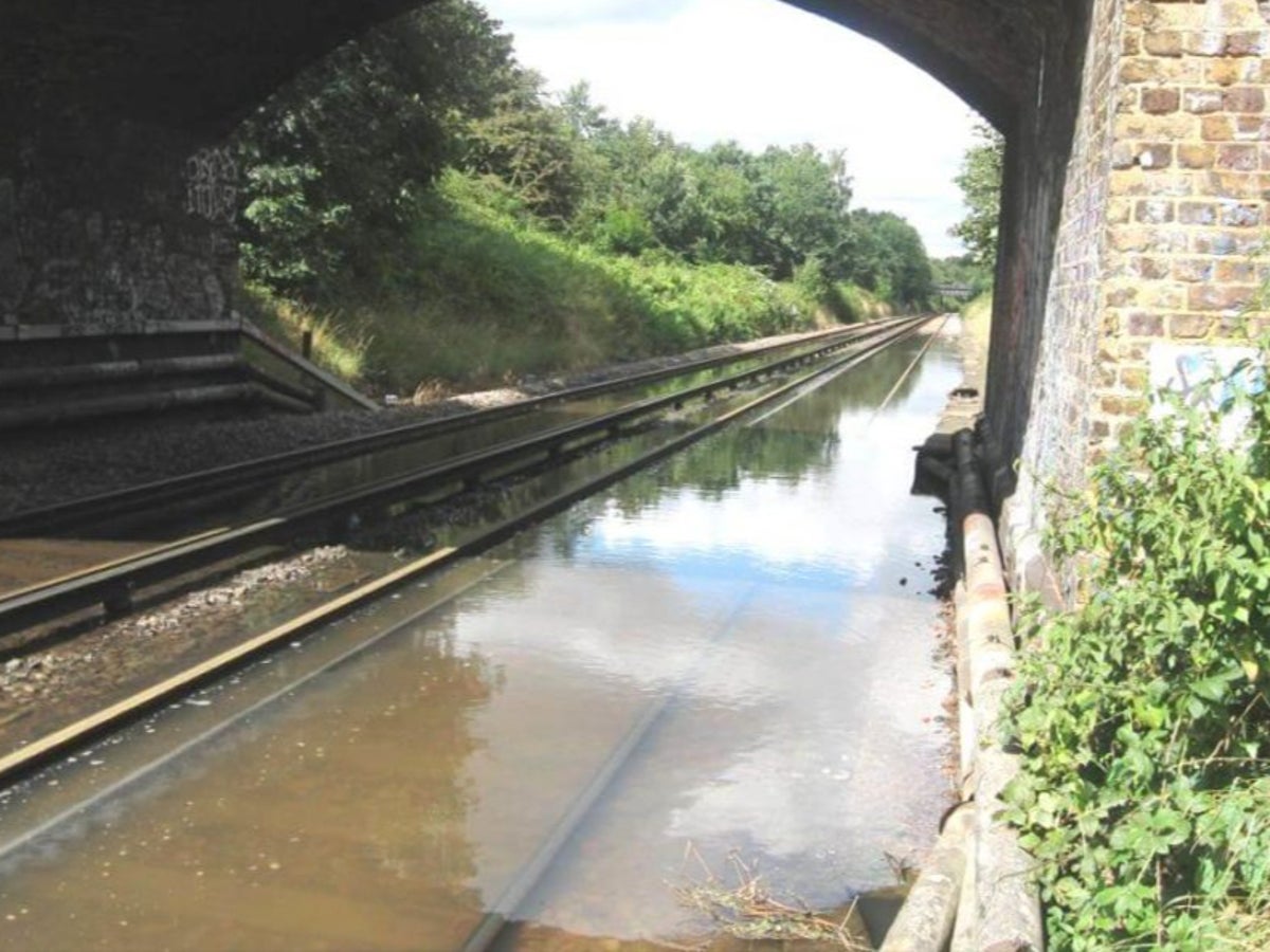 Travel chaos on tubes and trains after overnight flooding in London and southeast England