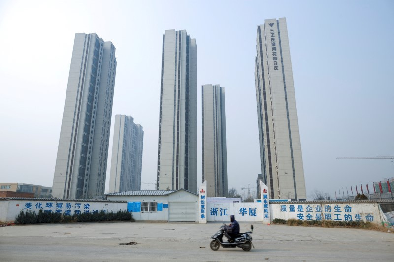 China boosts funds for housing projects to support embattled sector