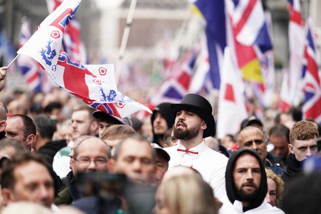 Thousands gather for Tommy Robinson’s protest as activist remains in custody