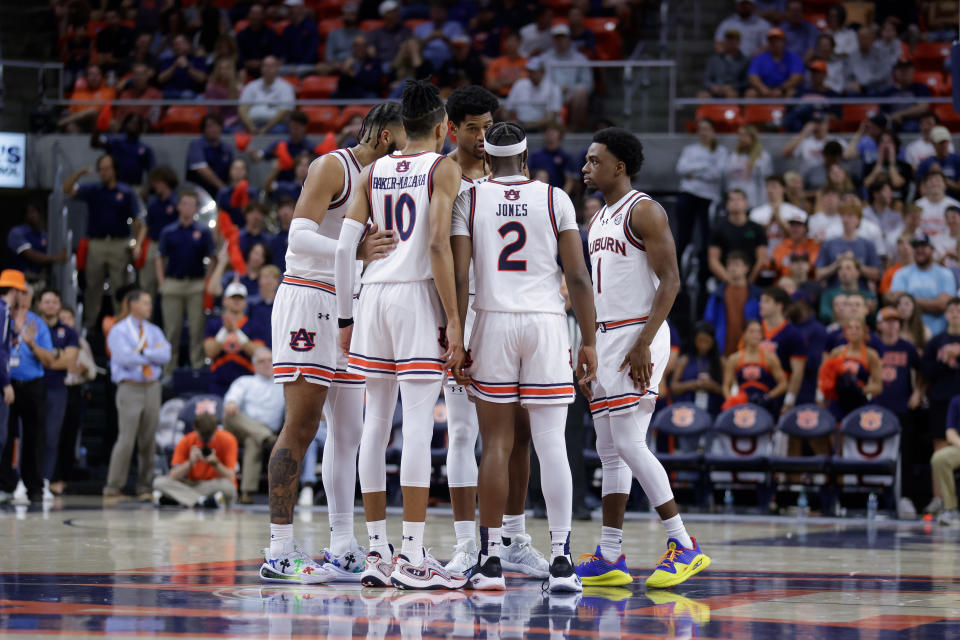 Auburn arrived in Houston without the two players who got in an in-flight altercation