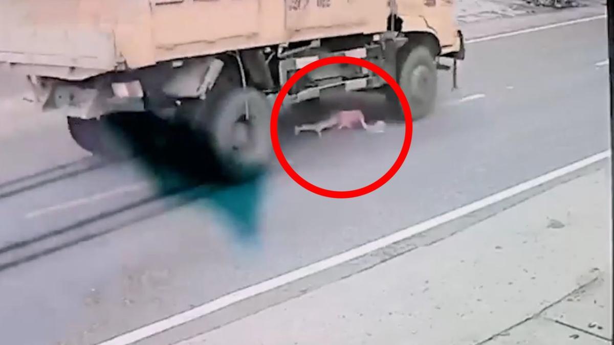 Girl almost crushed by truck in horrifying close call