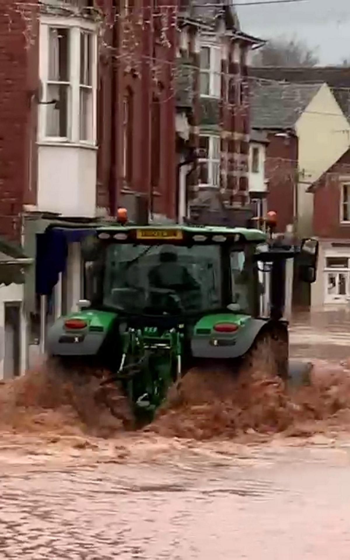 Man arrested over tractor drive through floods