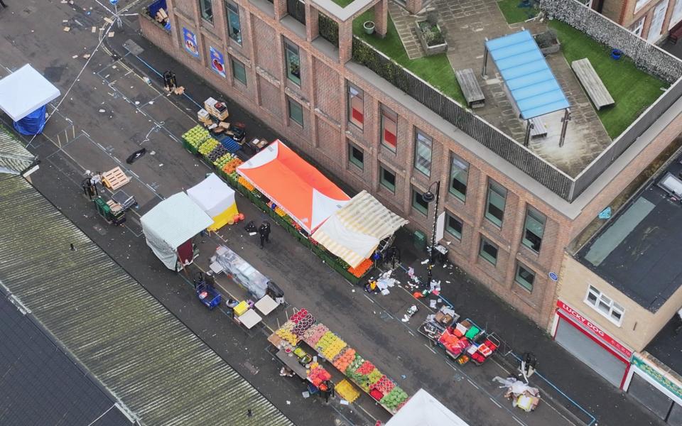 Man killed after three people stabbed at London street market