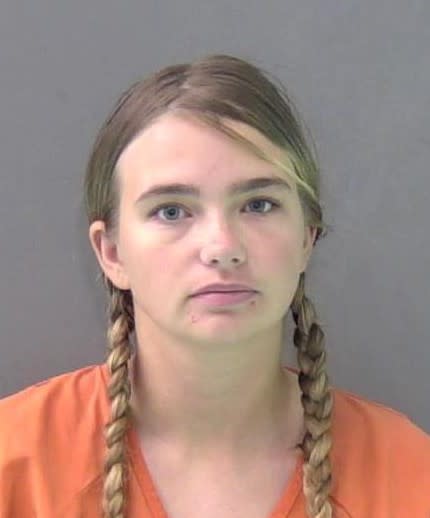 Woman accused of leaving child alone while out of town