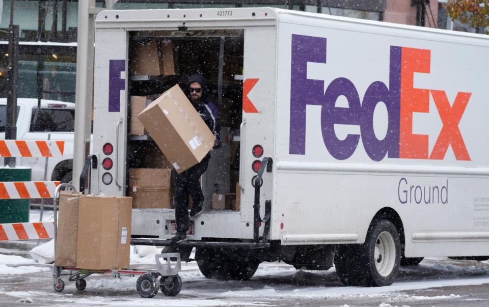 A FedEx driver running late on his routes ditched dozens of parcels in woods, Florida cops say