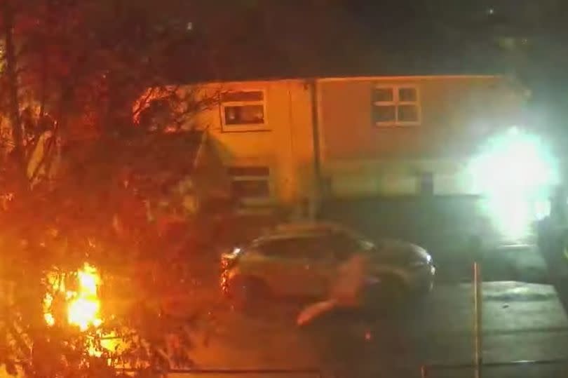 Cars burn in the street as arson attacks continue