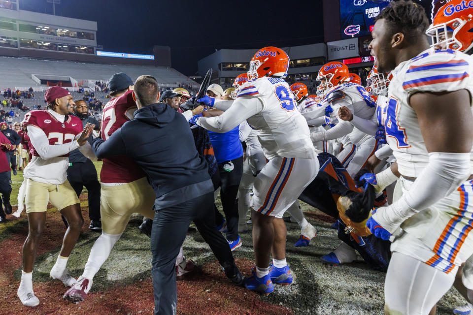 Flag-planting celebrations cause fights to break out in several heated college football rivalry games