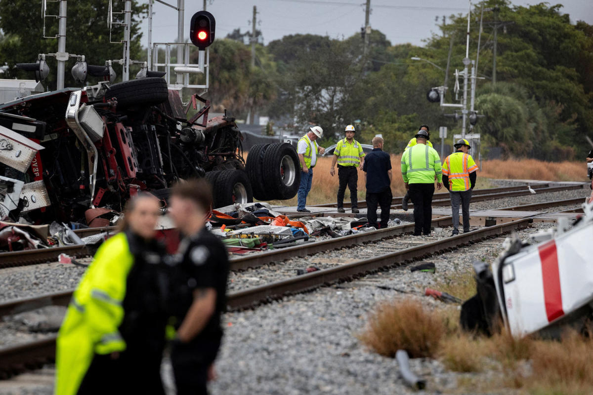 Passenger train collides with fire truck, injuring 3 firefighters and 12 others in Florida