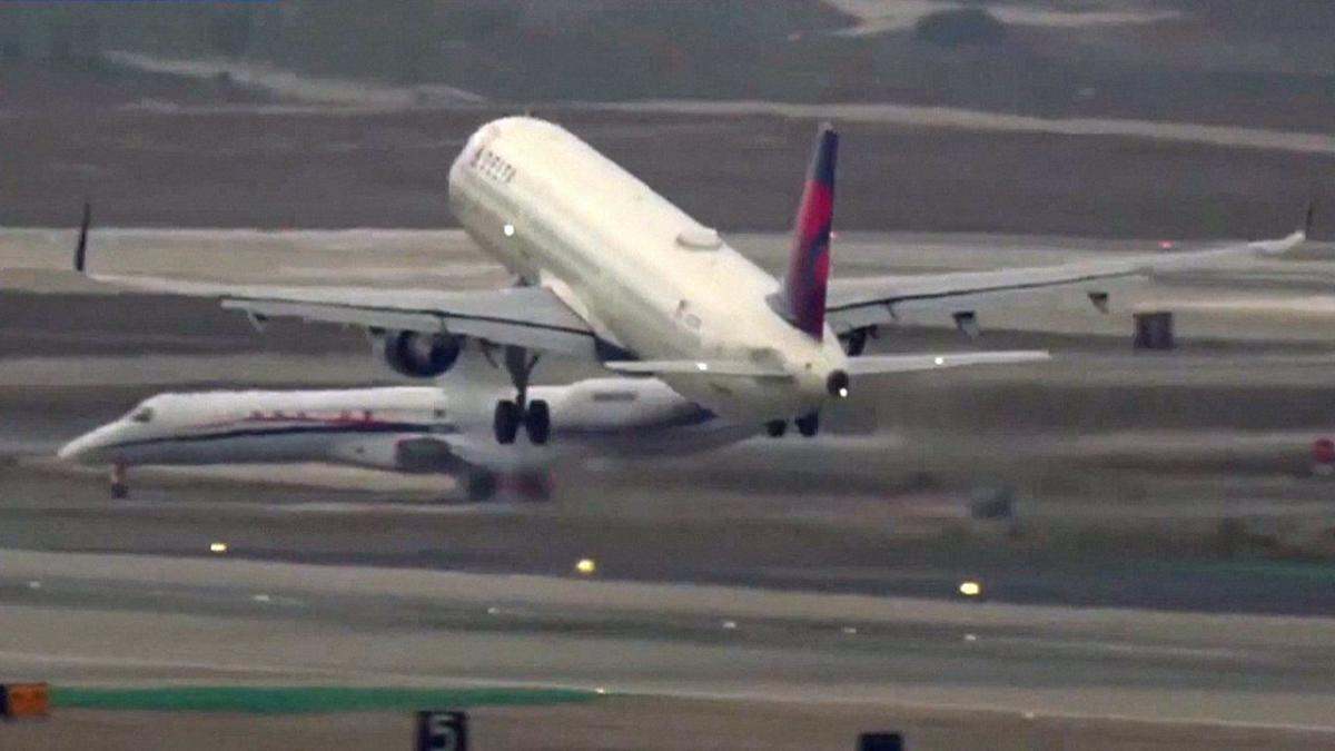 Terrifying near miss as LAX air traffic controller stops planes from colliding during take-off