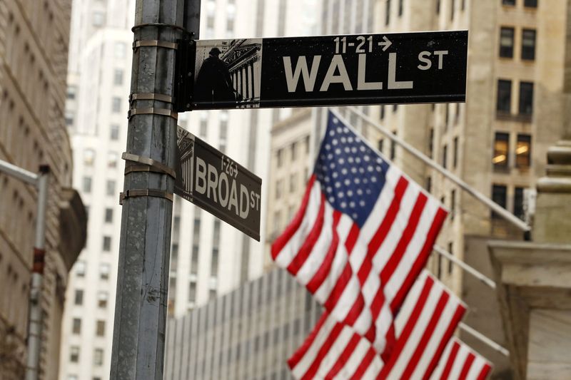 Wall Street tumbles as Fed projects slower rate cuts next year