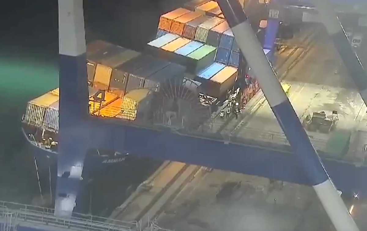 Watch scary moment workers flee as a cargo ship rolls onto its side at port in Istanbul