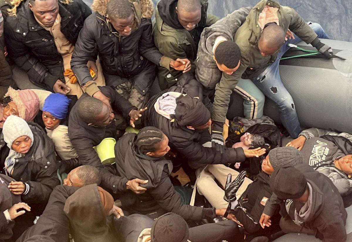 A photo captures rescue of a baby born on dangerous sea crossing to Spain’s Canary Islands