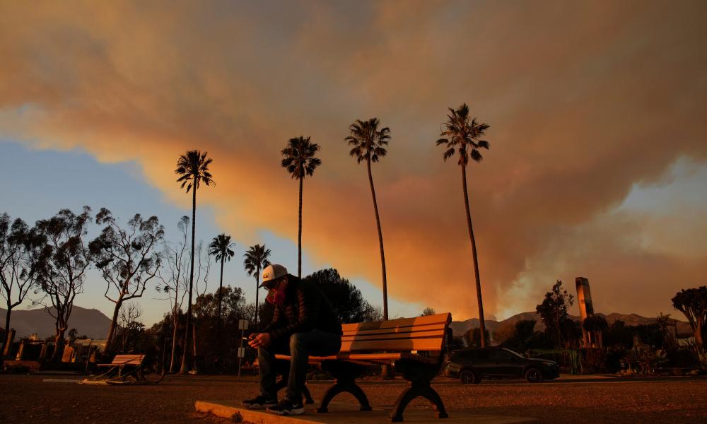 California fires: 16 killed and 10,000 structures destroyed as blazes continue