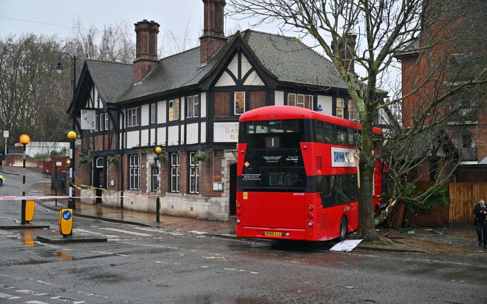 Double-decker narrowly avoids London pub after crashing in ‘horrific’ wet weather on New Year’s Day