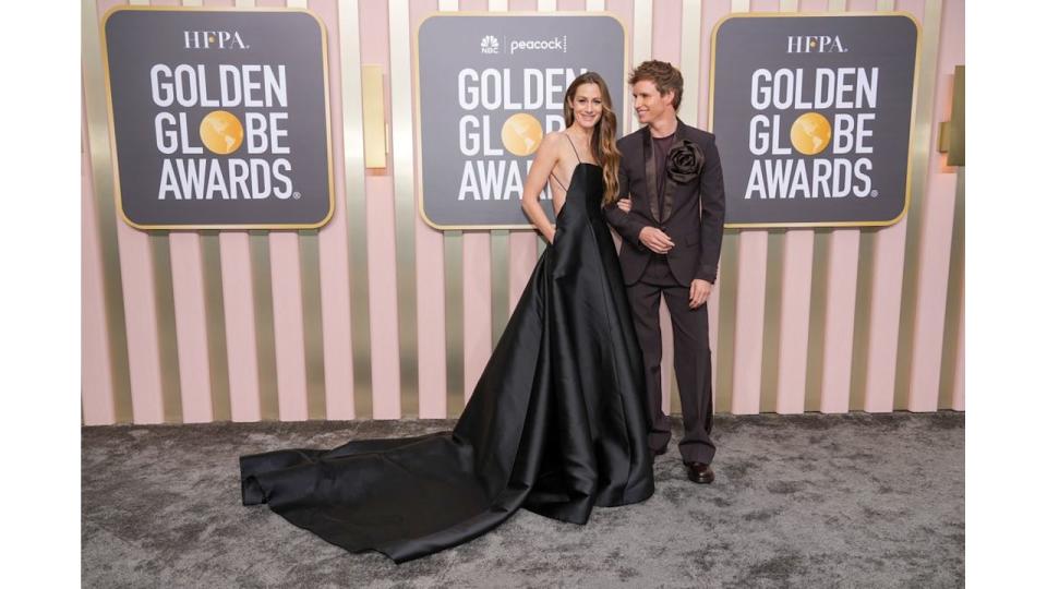 Eddie Redmayne puts on rare public display of affection with wife Hannah Bagshawe as he jets to LA for Golden Globes – exclusive