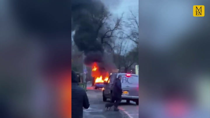 Horrifying footage shows moment BMW erupts into flames in street