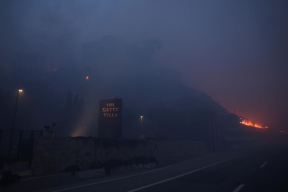 Rapidly spreading wildfire reaches Getty Villa museum in California