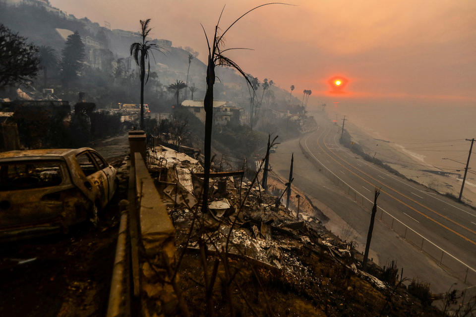 Stunning photos of Los Angeles fires show scale of devastation as blazes burn uncontrolled