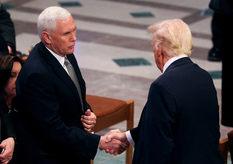 Trump shakes hands with Pence, engages Obama at Carter funeral