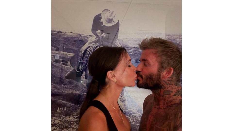 Victoria and David Beckham share rare passionate kiss as they ring in the New Year