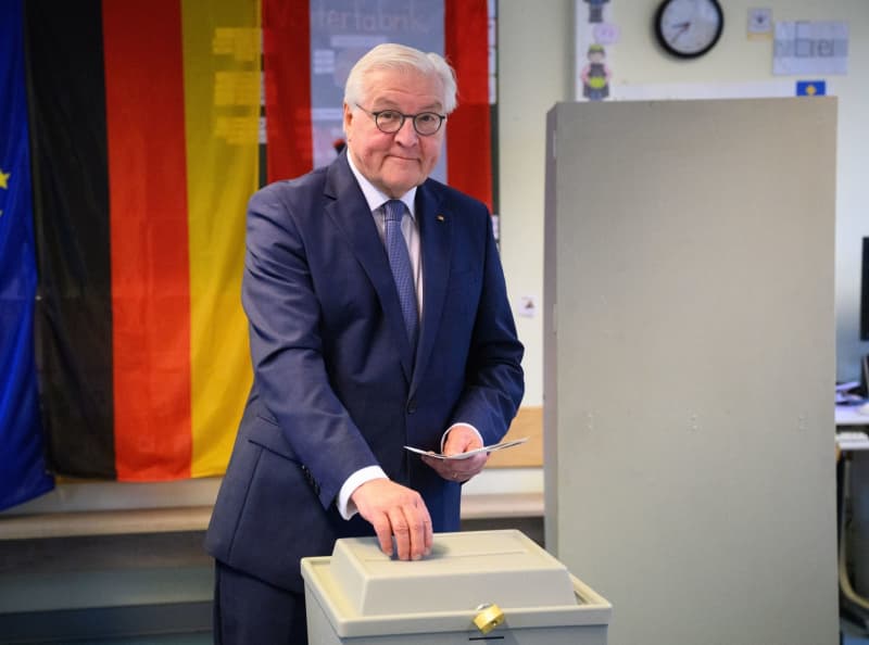 German president calls on citizens to vote as he casts his ballot