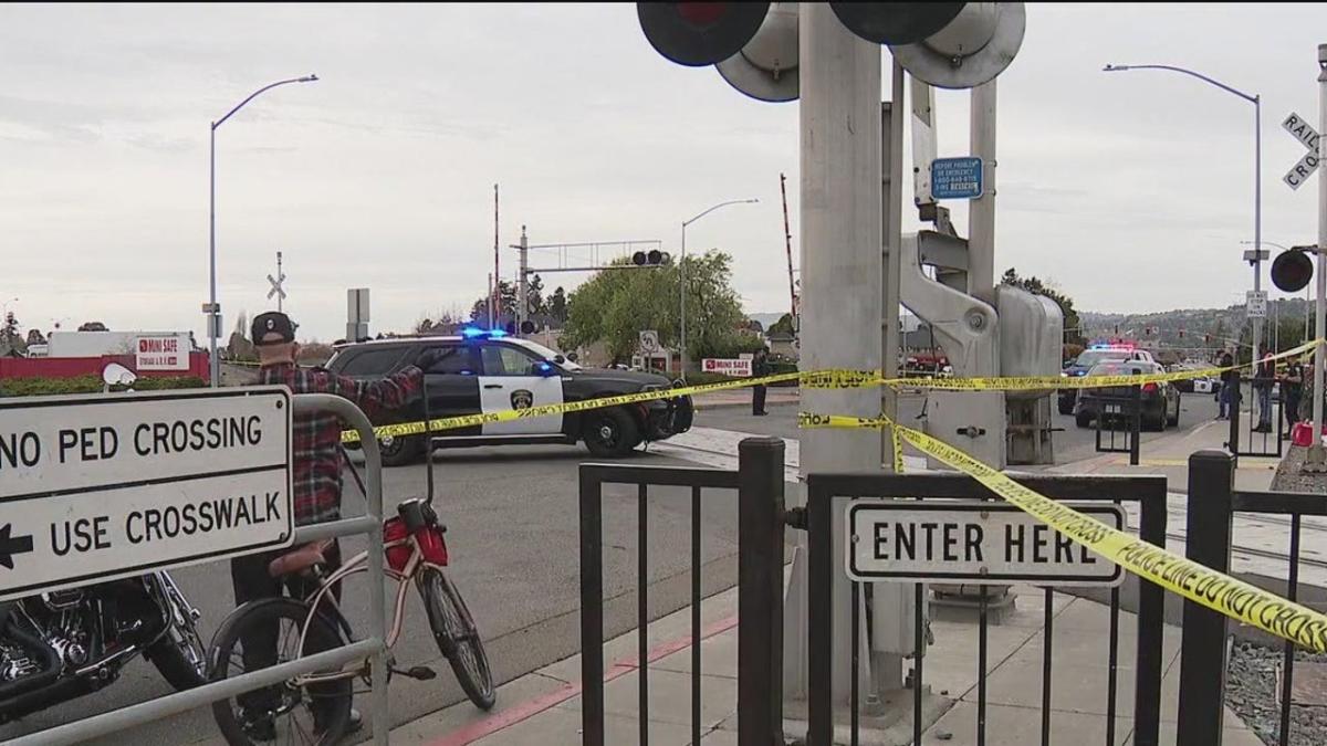 Motorcycle group of about 100 lift San Leandro railroad crossing arm; passenger dies