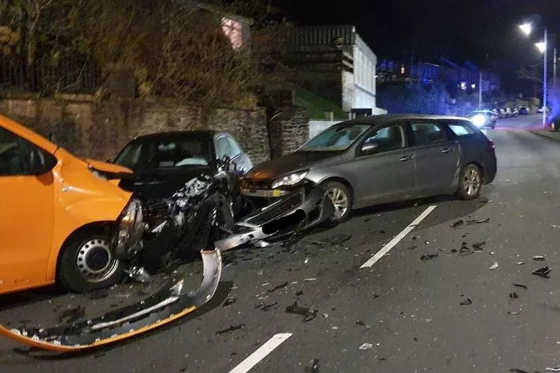 Multi-car crash shuts main road as police make arrest