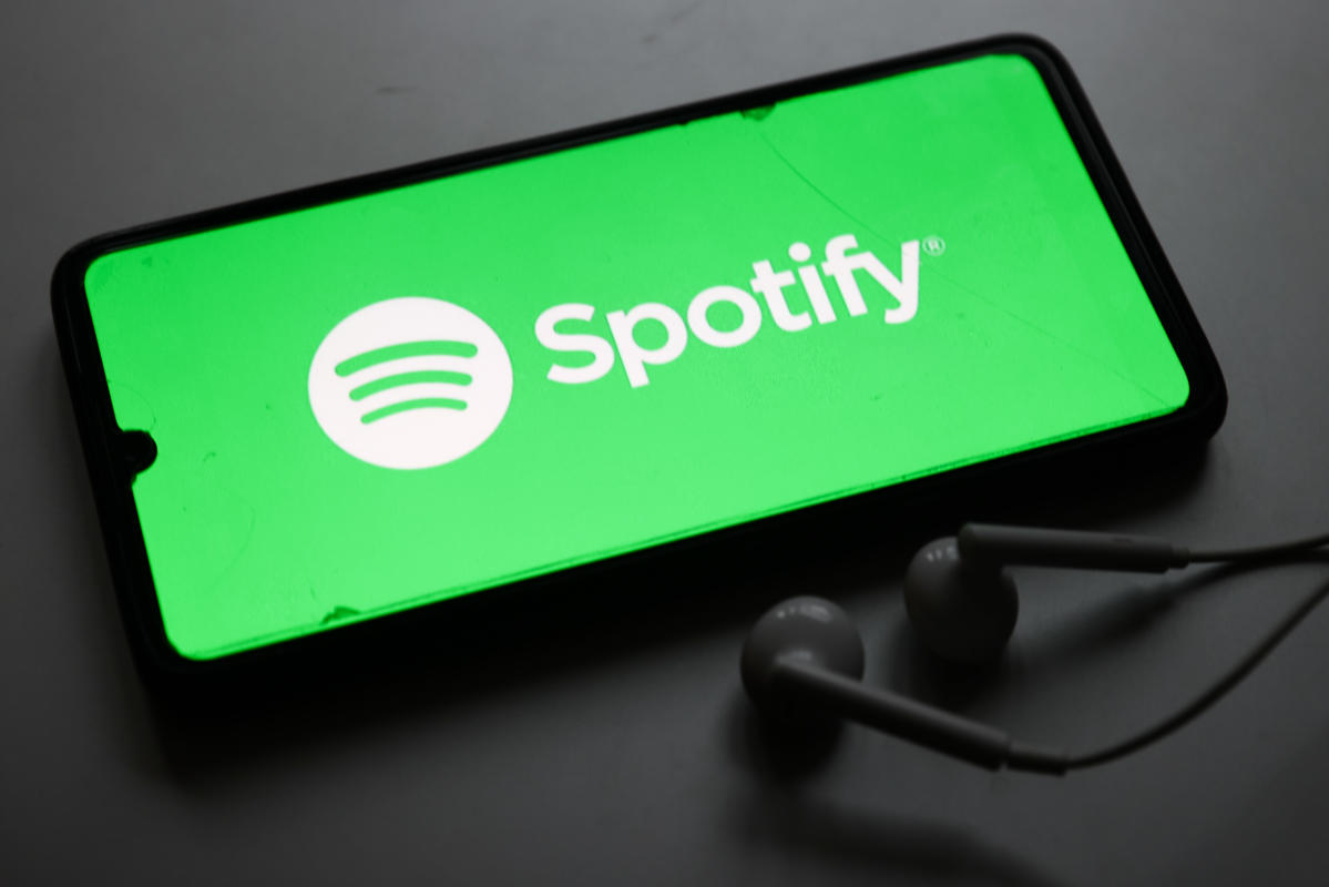 Spotify stock jumps after reporting its first full-year of profitability, strong user metrics