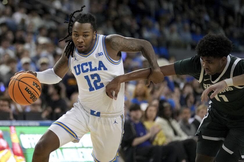 UCLA men withstand late pressure to get an impressive victory over No. 9 Michigan State